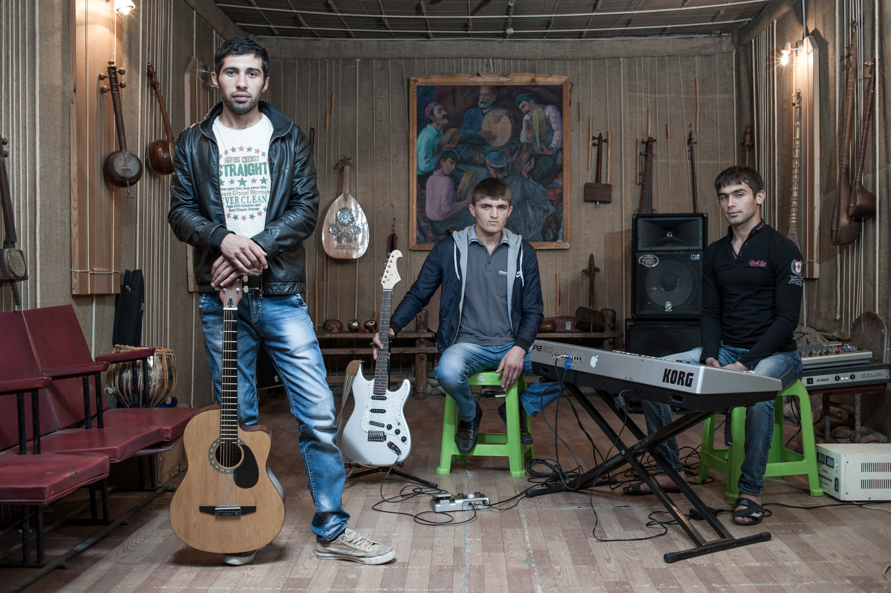 Konstantin Salomatin - 25 The band Jeray at their rehearsal room. From left to right – Akmal Ashurmamadov – solo singer, Ekhtibor Mirmasov – solo-guitar, Intizor Malikov – keybord. During the seson, which lasts from June to October here, they got around 4-5 weddings per month, each costs 600-700$ in their city, the other cities costs more. They perform their songs, some hits, and national music. They are going to finish their first solo album in the year of 2014, make first solo concert, but now they rehears only to prepair to it. Tajikistan, Dushanbe, Gurminch museum.